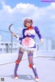 A woman dressed in a maid outfit holding a scythe.