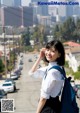 A woman with a backpack talking on a cell phone.